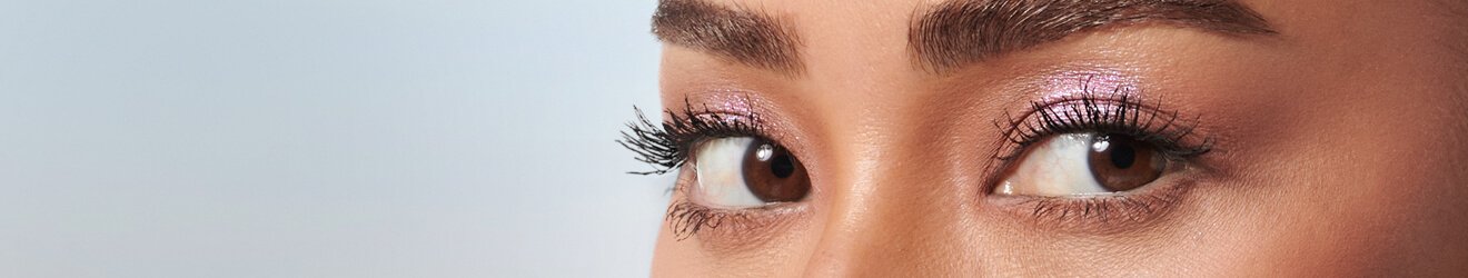 Maybelline Mascara products illustrative banner image - Close up of a woman's Eyes, with mascara